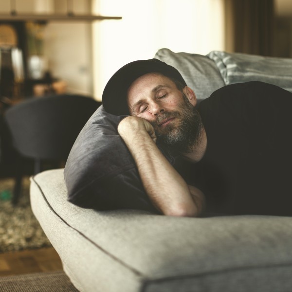Man sleeping on couch