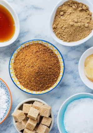 Bowls of different sugars on a countertop