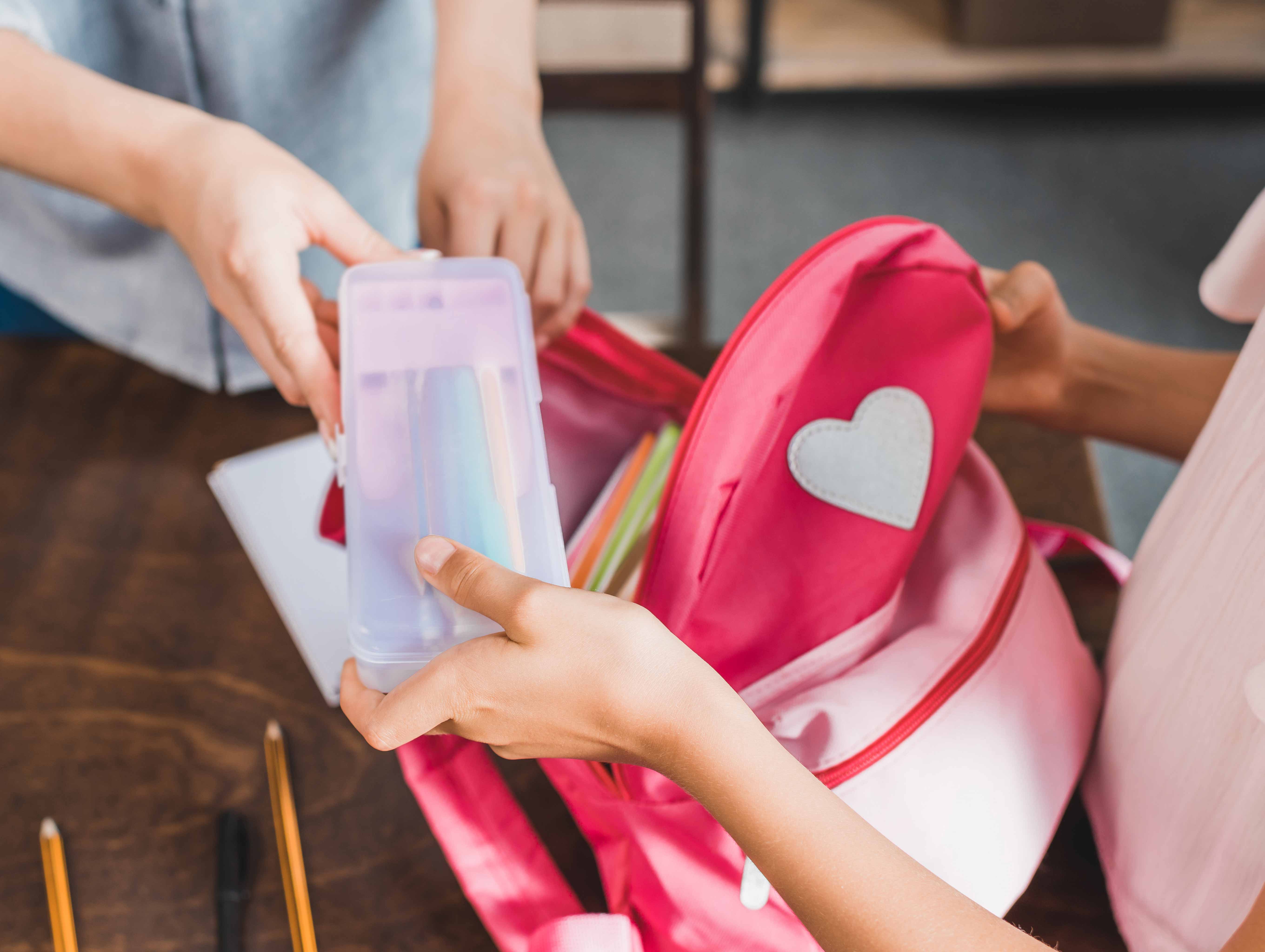 Parent and child packing school bag