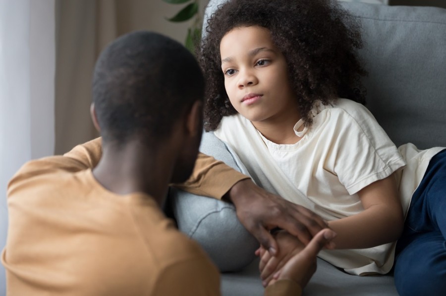 a dad explaining diabetes to his daughter