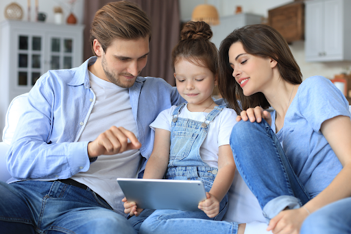 parents teaching diabetes to their daughter