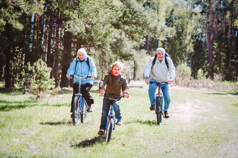 Grandparents and grandchild riding bikes