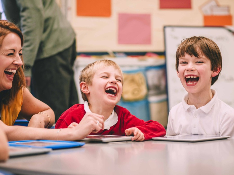 Children laughin in a classroom